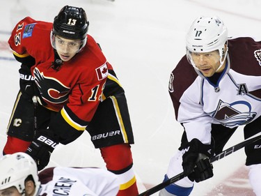 Calgary Flames forward Johnny Gaudreau lines up next to former Flame  Colorado Avalanche's Jerome Iginla during first period NHL action at the Scotiabank Saddledome Monday March 23, 2015.