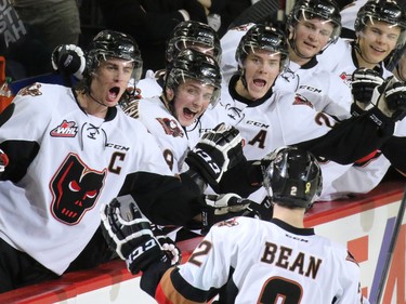 The Calgary Hitmen celebrate Jake Bean's goal in the closing minute of the first period against the Kootenay Ice. The game was the first in a best-of-seven playoff series against the Ice on Friday March 27, 2015.