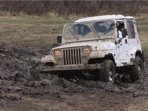 A Jeep crosses a muddy patch near the gravel pit in the Ghost-Waiporous area.