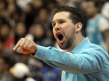 Bishop McNally Timberwolves coach Tyler Korol shouts out instructions to his players late in the game against the Sir Winston Churchill Bulldogs during the City High School Division One Basketball Championship, Saturday night  March 14, 2015 at the University of Calgary.