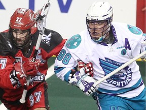 Calgary Rouhgnecks captain Andrew McBride tries to chase down Cody Jamieson of the Rochester Knighthawks as the Drillers drop a 13-7 decision in front of over 13,000 fans Saturday night  March 14, 2015 at the Saddledome.