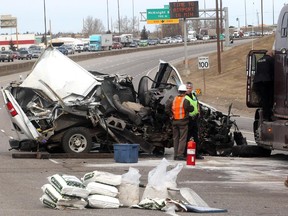 Emergency personell stand watch at a serious crash on Deerfoot Trail North at 32nd Avenue which saw a van collide with a tractor trailer.