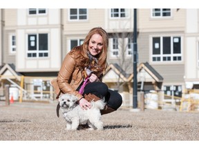 Roni Furgeson and her dog on a pathway in the community of Sherwood.