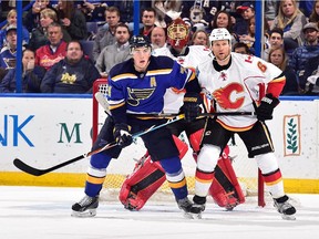 T.J. Oshie  of the St. Louis Blues skates against Dennis Wideman of the Calgary Flames during their last meeting this season, on Oct. 11, 2014 in St. Louis. Expectations were a lot different then for the Flames, who weren't seen as the playoff contenders they are now.