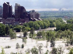 The swollen Bow River was photographed from Centre Street North after it flowed over its banks and submerged Prince's Island Park on June 21, 2013.