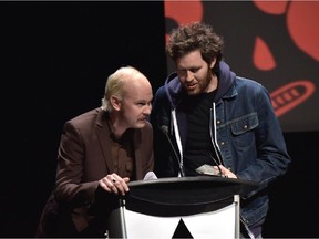 Calgary's Chad VanGaalen, right, accepts the Prism Prize on Sunday night in Toronto.