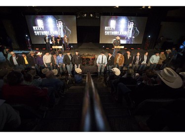 The drivers line up at the front of the auction stage before the 2015 GMC Rangeland Derby Canvas Auction at the Boyce Theatre at Stampede Park in Calgary, on March 19, 2015. His canvas sold to Tsuu Tina First Nation for $170,000.