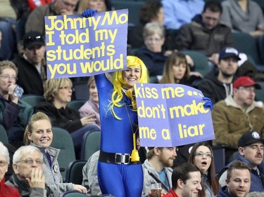 Lac La Biche's Danika Richard asks for a kiss from Team Canada Skip John Morris at the Scotiabank Saddledome on March 1, 2015.