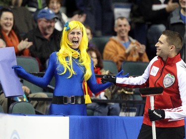 Lac La Biche's Danika Richard reacted after getting a kiss from Team Canada Skip John Morris in between the 6th and 7th ends during the Tim Hortons Brier at the Scotiabank Saddledome on March 1, 2015.