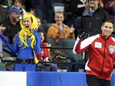 Lac La Biche's Danika Richard reacted after getting a kiss from Team Canada Skip John Morris in between the 6th and 7th ends during the Tim Hortons Brier at the Scotiabank Saddledome on March 1, 2015.