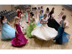 CALGARY, ; MARCH 16, 2015  -- The girls twirl around in the dresses while waiting for the judges dance competition to begin as they took part in the High River Spring Ball on March 14, 2015. The Ball follows two months of hard work as the grade 11 students in the community learned proper etiquette, how to behave at a job interview and ballroom dancing.  (Lorraine Hjalte/Calgary Herald) For Lifestyles story by Shelley Boettcher. Trax # 00063362A