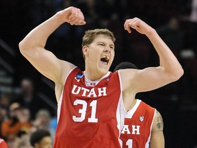 Utah centre Dallin Bachynski of Calgary celebrates after his team beat Georgetown 75-64 in the second round of the NCAA basketball tournament on Saturday.