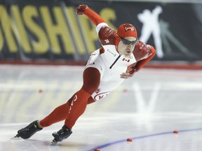 Denny Morrison of Canada skates to victory in the 500 metre race at the ISU Allround Speed Skating World Championship at the Olympic Oval in Calgary, Saturday, March 7, 2015.