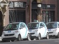 Cars from Car2Go vehicle sharing service clog an area in front of the The Belfry restaurant on 8th Avenue SW downtown Wednesday March 18, 2015.