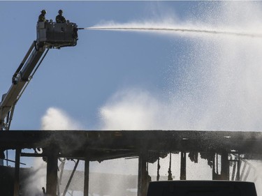 Smoke and fire engulf a building construction site at the corner of 17 Ave and Centre St SW in Calgary, on March 7, 2015.