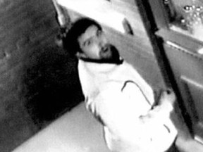 Police released this surveillance camera image of man sought in connection with the vandalism of a bylaw office.