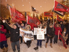 Union members protest Bill 45 in front of the legislature in December 2013. In a conciliatory move, Premier Jim Prentice announced this week he was scrapping the controversial legislation.