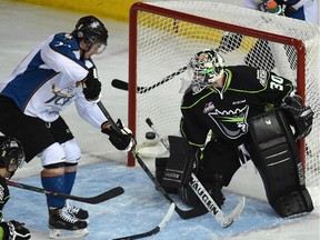 Kootenay's Tim Bozon, seen scoring on Edmonton's Tristan Jarry during a game in January, will lead the Ice into the WHL playoffs against the Calgary Hitmen starting on Friday.