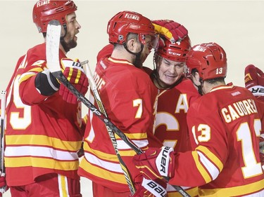 Calgary Flames celebrate scoring their second goal of the second period, putting them up by two against the Philadelphia Flyers during NHL action at the Saddledome in Calgary, on March 19, 2015.