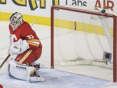 Calgary Flames goalie Karri Ramo lucks out as the puck dings off the crossbar during third period NHL action against the Philadelphia Flyers at the Saddledome in Calgary, on March 19, 2015.