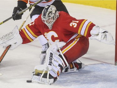 Calgary Flames goalie Karri Ramo makes a big save during third period NHL action at the Saddledome in Calgary, on March 19, 2015.