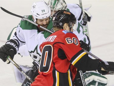 Calgary Flames Markus Granlund gets a penalty after whacking Dallas Stars Jordie Benn in the face with his stick during game action at the Saddledome in Calgary, on March 25, 2015.