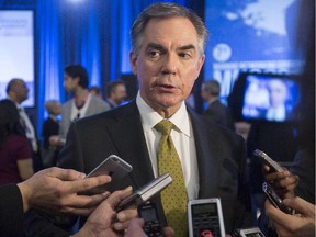 Alberta Premier Jim Prentice speaks to members of the media during the 2015 Manning Networking Conference in Ottawa, March 6, 2015.