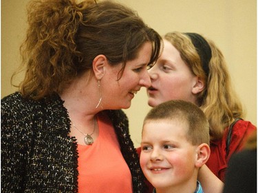 Carrie Fischer shares a moment with her kids, Kaitlyn and Luke, after winning the PC nomination in the Highwood riding at the Highwood Memorial Centre in High River on Saturday, March 28, 2015.