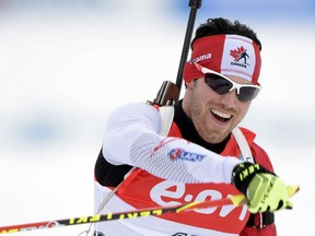 Calgary's Nathan Smith celebrates after crossing the line second in the men's 10km sprint in the IBU Biathlon World Championships in Kontiolahti, Finland on Saturday. It was the first time a Canadian male has medalled at worlds.