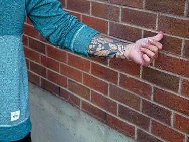Tattoos peeking out of a sleeve always look edgy and cool.