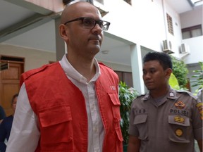 Canadian teacher Neil Bantleman leaves a court room after his trial in Jakarta on March 12, 2015.