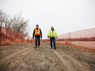 Doug Marter and Jim Klimes walk through the Inglewood Bird Sanctuary in Calgary on Monday, March 23, 2015.