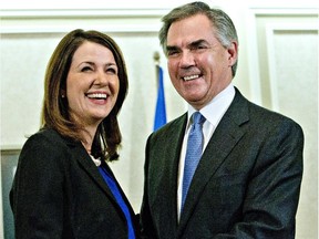 Ousted Tory candidate and former Wildrose leader Danielle Smith poses with Premier Jim Prentice just after she crossed the floor in December.