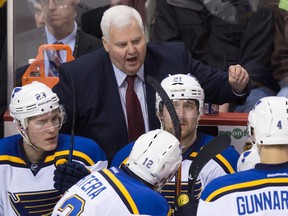 St. Louis Blues' head coach Ken Hitchcock gives instructions to his players during a game in Vancouver earlier this month. The veteran bench boss is the fourth member of the NHL coaching fraternity's 700-win club.