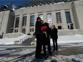 Lee Carter and her husband Hollis Johnson, supporters of assisted dying, hug outside the Supreme Court of Canada after the court threw out the ban on assisted suicide in February.