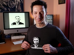 Sead Tokalic, part owner of Frontier Metropolis, a local T-shirt company in Calgary, displays a Jim Prentice T-shirt.