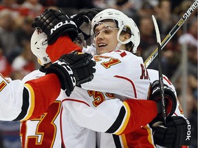 Calgary Flames left wing Mason Raymond (21) celebrates his goal against the Detroit Red Wings in the third period of an NHL hockey game in Detroit Friday, March 6, 2015.