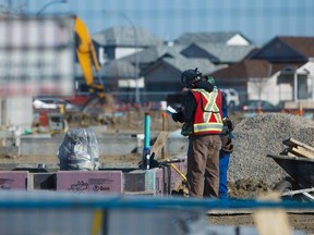 Mikaela MacKenzie/ Construction workers build a new school in NE Calgary.