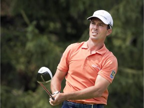 Canada's Mike Weir, from Bright's Grove, Ont., tees off during second round play at the Canadian Open golf championship at Royal Montreal golf club in Montreal on Friday, July 25, 2014.