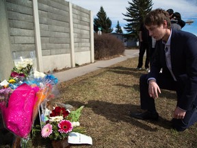 Robert Bloome, Justin McKinnon-Blomme's half brother, visits Justin's memorial along Southland Drive in Calgary on Sunday, March 29, 2015. McKinnon-Blomme was found less than a block away from the memorial site.