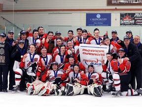 Membrs of the Strathmore-based UFA Bisons pose with their new banner after winning the Alberta Major Midget Hockey Championship on Sunday in Edmonton.