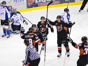 The Calgary Hitmen celebrate one of their eight goals against the Kootenay Ice in Game 3 of their opening round Western Hockey League playoff series on Tuesday night.