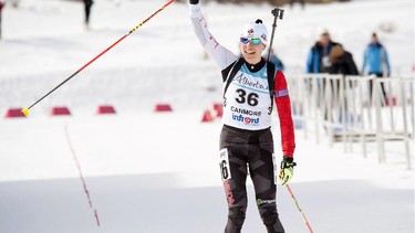 Zina Kocher waves to the crowd as she crosses the line second in Sunday's women's sprint race at the IBU Cup, held at the Canmore Nordic Centre on Sunday. The event continues through next weekend.
