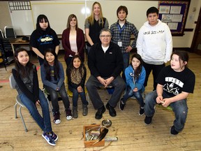 Piitoayis Family School sees Grade 5-6 students attend Ghost River Rediscovery sessions with elders. Participants included (back row left to right) Latesha English, Tammy Parent, Jennifer Vanthuyne (youth leadership program co-ordinator), John Gasparich (camp co-ordinator) and Roy Scott. Front row left to right: Thea Holy Singer, Krisha Little Light, Teanna Bear Hat-Little Light, Randy Bottle (elder and cultural teacher), Skye Hall and Cody Reinhart.