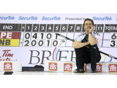 PEI skip Adam Casey sat on the endboards waiting for the sixth end to start during the morning draw against New Brunswick at the Tim Hortons Brier at the Scotiabank Saddledome in Calgary on March 5, 2015.