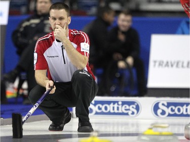 Newfoundland/Labrador skip Brad Gushue pondered his call as he watched from the house during their game against the Northwest Territories at the Tim Hortons Brier at the Scotiabank Saddledome on March 1, 2015.