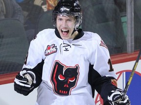 Adam Tambellini of the Calgary Hitmen celebrates after scoring a goal against the Kootenay Ice during the first period at Scotiabank Saddledome in Calgary on Thursday March 27, 2014.