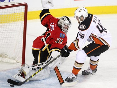 Calgary Flames goalie Karri Ramo stretched to stop a shot by Anaheim Ducks left winger Jiri Sekac during first period NHL action at the Scotiabank Saddledome on March 11, 2015.