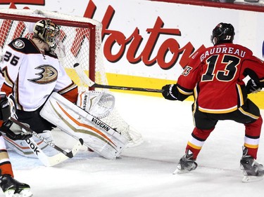 Calgary Flames left winger Johnny Gaudreau watched as his shot slipped past Anaheim Ducks goalie John Gibson to tie the game at 2-2 during first period NHL action at the Scotiabank Saddledome on March 11, 2015.