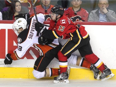 Calgary Flames left winger Johnny Gaudreau ran Anaheim Ducks right winger Jakob Silfverberg into the boards during third period NHL action at the Scotiabank Saddledome on March 11, 2015. The Flames won the game 6-3.